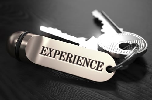 Experience Concept. Keys with Keyring on Black Wooden Table. Closeup View, Selective Focus, 3D Render. Black and White Image.